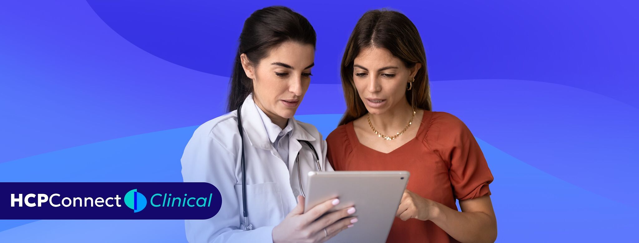 A doctor and patient look at a clip board together